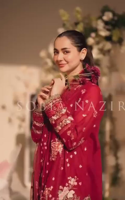 Sobia Nazir offers a premium lawn shirt featuring an intricately embroidered neck and a heavily embroidered front.