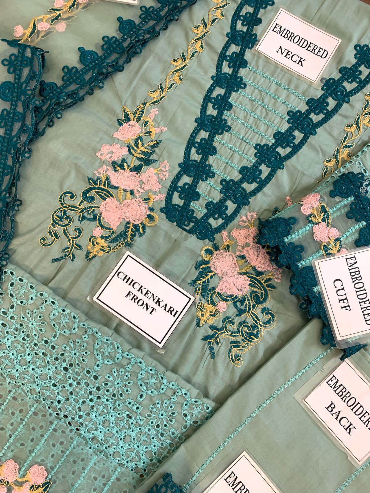 Premium dress featuring a front lawn print, complemented by an embroidered patch on the daman.