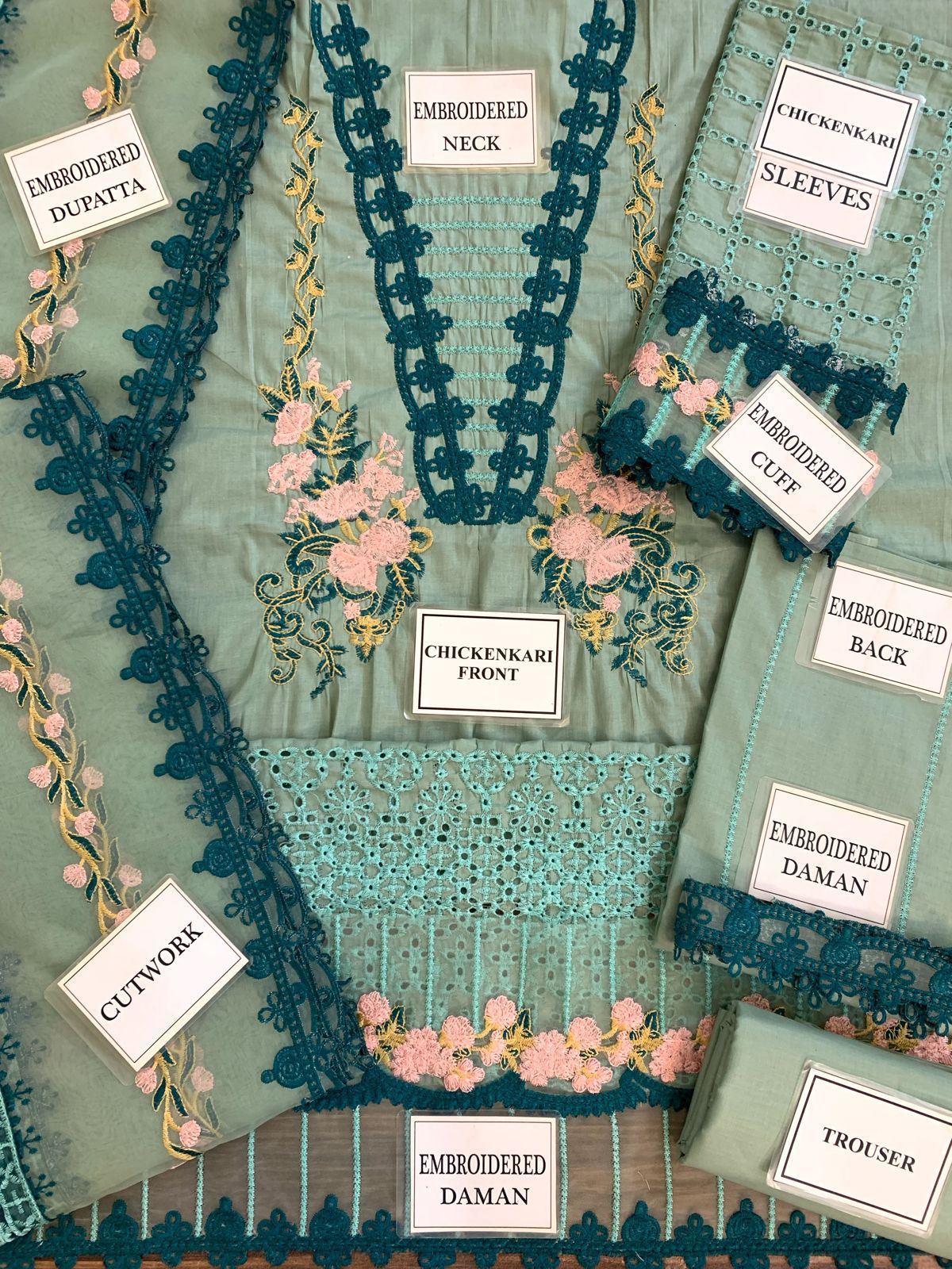 Premium dress featuring a front lawn print, complemented by an embroidered patch on the daman.